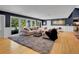 Bright and airy living room with hardwood floors and backyard views at 5350 Yellowstone St, Bow Mar, CO 80123