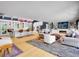 Spacious living room with hardwood floors and open concept to kitchen at 5350 Yellowstone St, Bow Mar, CO 80123