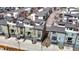 Modern townhome community featuring rooftop decks and private garages in a planned neighborhood at 8742 E 47Th Ave, Denver, CO 80238