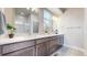 Spacious bathroom featuring double vanity, modern fixtures, and ample counter space at 8742 E 47Th Ave, Denver, CO 80238