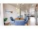Tasteful dining room featuring modern decor, a lovely wall painting, and open concept design at 8742 E 47Th Ave, Denver, CO 80238