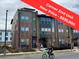 Attractive end-unit townhome with brick accents and modern design, offering a stylish exterior at 8742 E 47Th Ave, Denver, CO 80238