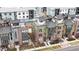 Modern townhomes feature rooftop patios and brick and siding exteriors at 8742 E 47Th Ave, Denver, CO 80238