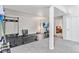 Spacious basement area featuring workout equipment, rubber mat, and separate carpeted space at 6643 Orion Ct, Arvada, CO 80007
