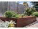 A raised garden bed showcasing a variety of flowers and foliage at 6643 Orion Ct, Arvada, CO 80007