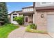 Charming brick home with a cozy front porch and landscaped garden for curb appeal at 6643 Orion Ct, Arvada, CO 80007