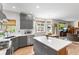 Bright, modern kitchen with a large island, stainless steel appliances, and backyard views at 6643 Orion Ct, Arvada, CO 80007