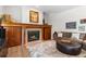 Comfortable living space with a fireplace, wood accents, and stylish decor for relaxing evenings at 6643 Orion Ct, Arvada, CO 80007