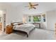 Bright main bedroom with natural light from large windows and featuring a vaulted ceiling and ceiling fan at 6643 Orion Ct, Arvada, CO 80007
