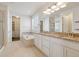 Bright bathroom with double sinks, granite countertops, a soaking tub, and a separate shower at 11896 Meade Ct, Westminster, CO 80031