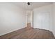 Bright bedroom boasts wood floors, a ceiling fan, and a large closet, offering comfortable living space at 11896 Meade Ct, Westminster, CO 80031
