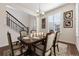 Charming dining room with a wooden table, seating for six, elegant decor and great natural light at 11896 Meade Ct, Westminster, CO 80031