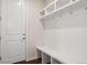 Bright mudroom boasts a built-in bench, cubbies, and coat hooks, providing practical storage and organization at 11896 Meade Ct, Westminster, CO 80031