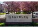 Bradburn neighborhood entrance with a tree-lined street adds beauty to the community at 11896 Meade Ct, Westminster, CO 80031