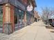 View of retail shops with brick facades and inviting storefronts offering a unique shopping experience at 11896 Meade Ct, Westminster, CO 80031