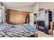 Bedroom featuring large closet, washer/dryer and carpeted floors, creating a comfortable and functional living space at 1192 S Zeno Way # E, Aurora, CO 80017