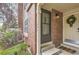 Inviting entryway with a brick facade and a decorative wreath at 1192 S Zeno Way # E, Aurora, CO 80017