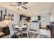 Well-lit dining area adjacent to kitchen with dark cabinets at 1192 S Zeno Way # E, Aurora, CO 80017