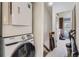 Bright laundry area with washer and dryer, located near the bonus room, providing convenience at 1192 S Zeno Way # E, Aurora, CO 80017