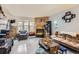 Open living area featuring hardwood floors and a fireplace at 1192 S Zeno Way # E, Aurora, CO 80017
