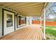 Covered patio and fenced backyard with lush green lawn at 3342 S Flamingo Way, Denver, CO 80222