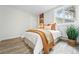 Cozy bedroom offers a bright window, natural light, stylish decor, and comfortable furnishings, for relaxation at 3342 S Flamingo Way, Denver, CO 80222