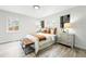 Bright bedroom featuring wood-look flooring and a decorative metal dresser at 3342 S Flamingo Way, Denver, CO 80222