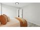 Neutral bedroom showcasing wood-look flooring and cozy bedding at 3342 S Flamingo Way, Denver, CO 80222