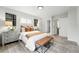 Bright bedroom featuring wood-look flooring and warm accents at 3342 S Flamingo Way, Denver, CO 80222