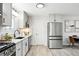 Modern kitchen equipped with stainless steel appliances and stylish gray cabinets at 3342 S Flamingo Way, Denver, CO 80222