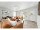 Open concept living room with ample natural light and stylish furnishings at 3342 S Flamingo Way, Denver, CO 80222