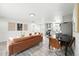 Open-concept living space with modern furnishings, dining area and updated kitchen at 3342 S Flamingo Way, Denver, CO 80222