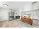 Spacious open living and dining area with modern decor and stainless steel appliances at 3342 S Flamingo Way, Denver, CO 80222