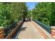 A charming park bridge surrounded by lush greenery and trees at 3342 S Flamingo Way, Denver, CO 80222