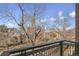 Balcony view overlooking the city skyline and trees at 1630 N Clarkson St # 320, Denver, CO 80218