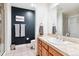 Modern bathroom with a vanity, toilet, and shower at 1630 N Clarkson St # 320, Denver, CO 80218