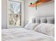 Bright bedroom with a comfortable bed and city views at 1630 N Clarkson St # 320, Denver, CO 80218