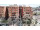 Brick building exterior with multiple levels and balconies at 1630 N Clarkson St # 320, Denver, CO 80218