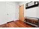 Bright condo entryway with wood floors and storage bench at 1630 N Clarkson St # 320, Denver, CO 80218