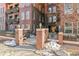 Building entrance with brick columns and walkway at 1630 N Clarkson St # 320, Denver, CO 80218