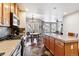 Open concept kitchen with island and hardwood floors at 1630 N Clarkson St # 320, Denver, CO 80218