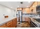 Modern kitchen with stainless steel appliances and granite counters at 1630 N Clarkson St # 320, Denver, CO 80218