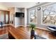 Open living space with hardwood floors and access to a balcony at 1630 N Clarkson St # 320, Denver, CO 80218