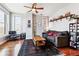 Bright living room with hardwood floors, large windows, and comfortable seating at 1630 N Clarkson St # 320, Denver, CO 80218