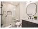 Modern bathroom with a glass-enclosed shower, sleek vanity, and elegant fixtures, offering a spa-like experience at 4211 Vallejo St, Denver, CO 80211