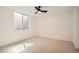 Minimalist bedroom with a large window allowing natural light, offering a serene and comfortable atmosphere at 4211 Vallejo St, Denver, CO 80211
