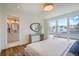 Bedroom featuring a vanity area with a mirror and a view into an ensuite bathroom at 4211 Vallejo St, Denver, CO 80211