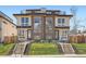 Modern townhomes boasting clean lines, large windows, and landscaped front yards, exuding contemporary charm at 4211 Vallejo St, Denver, CO 80211