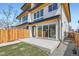 Back of home featuring a contemporary design with large sliding glass doors and a patio at 4211 Vallejo St, Denver, CO 80211