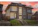 Modern duplex featuring a rooftop deck, large windows, and a well-manicured front yard at 4211 Vallejo St, Denver, CO 80211